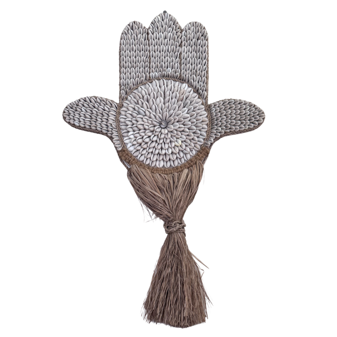 Decorative tassel with floral design on a white background