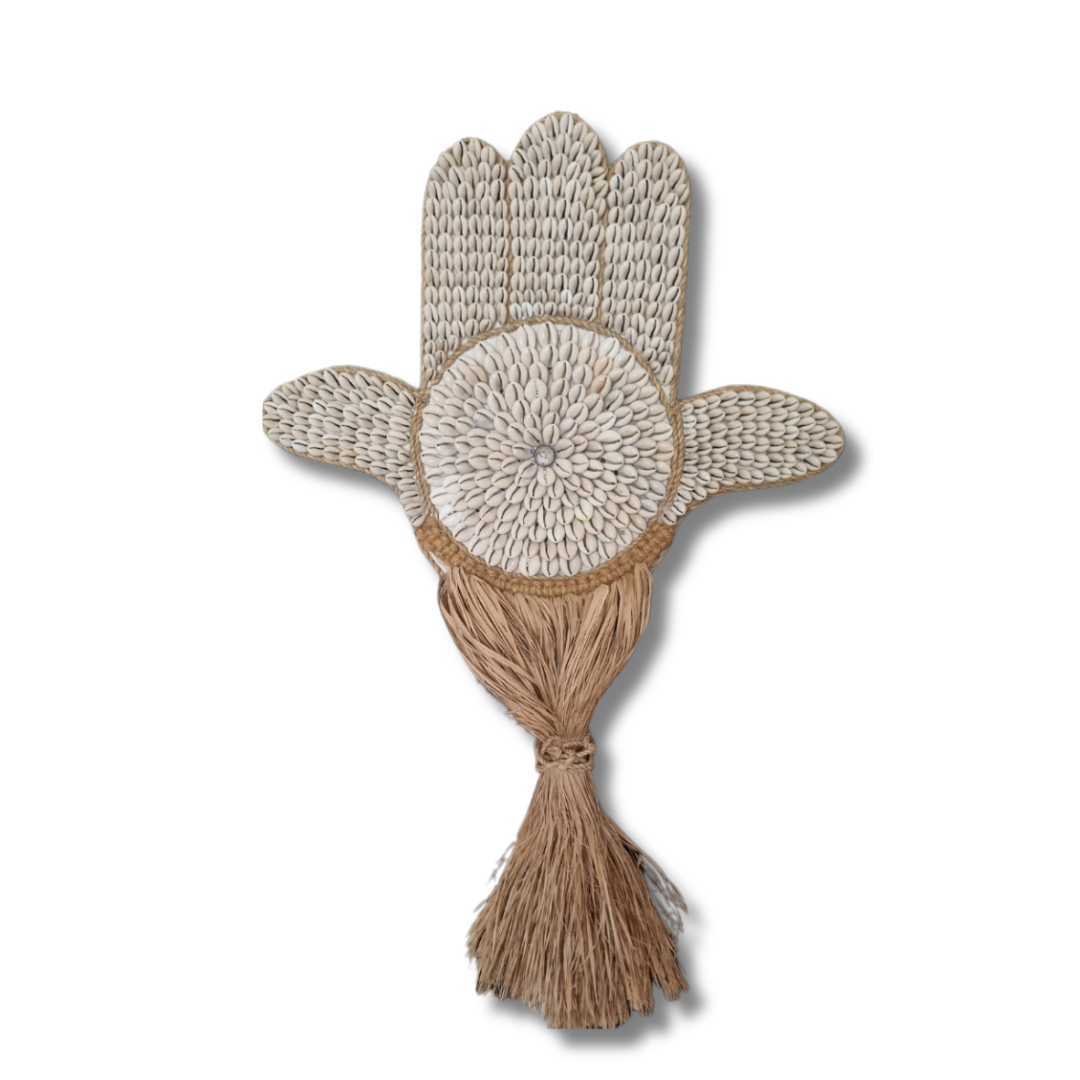Decorative wall art with a floral design and tassel on a white background