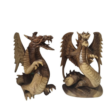 Two hand-carved statues with varying details in pose and design, showcasing the unique craftsmanship of each piece.