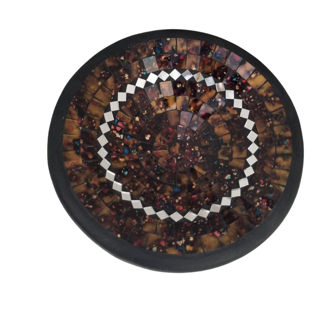 Round mosaic art piece with concentric patterns on a white background