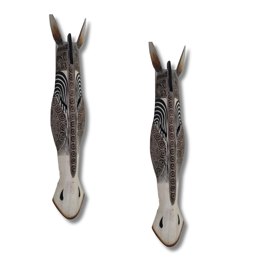 Two decorative animal wall masks with intricate patterned designs, displayed on a white background.
