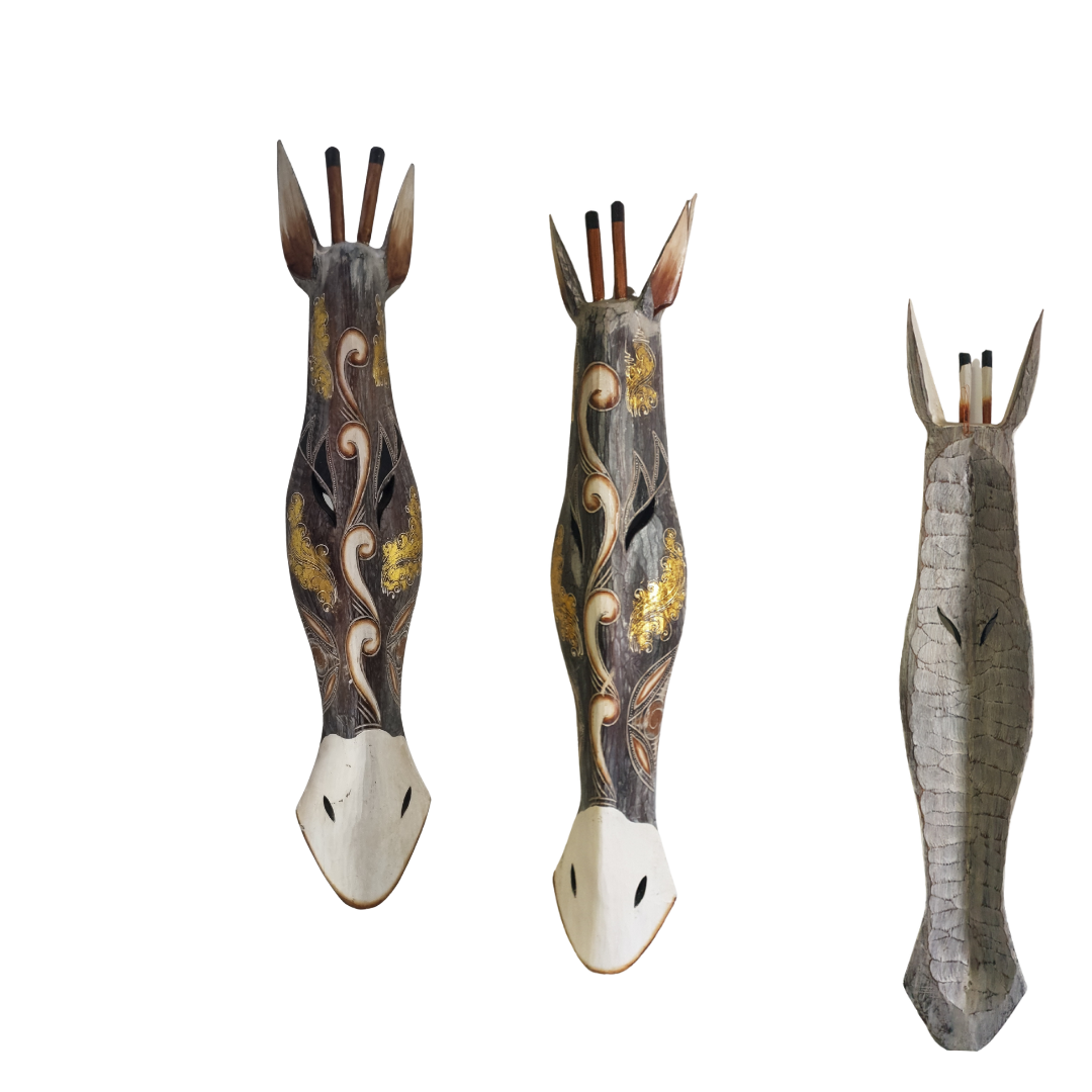 Wooden giraffe carvings shown in three angles from front to back view, featuring beautiful gold and grey tones, displayed against a white background wall.