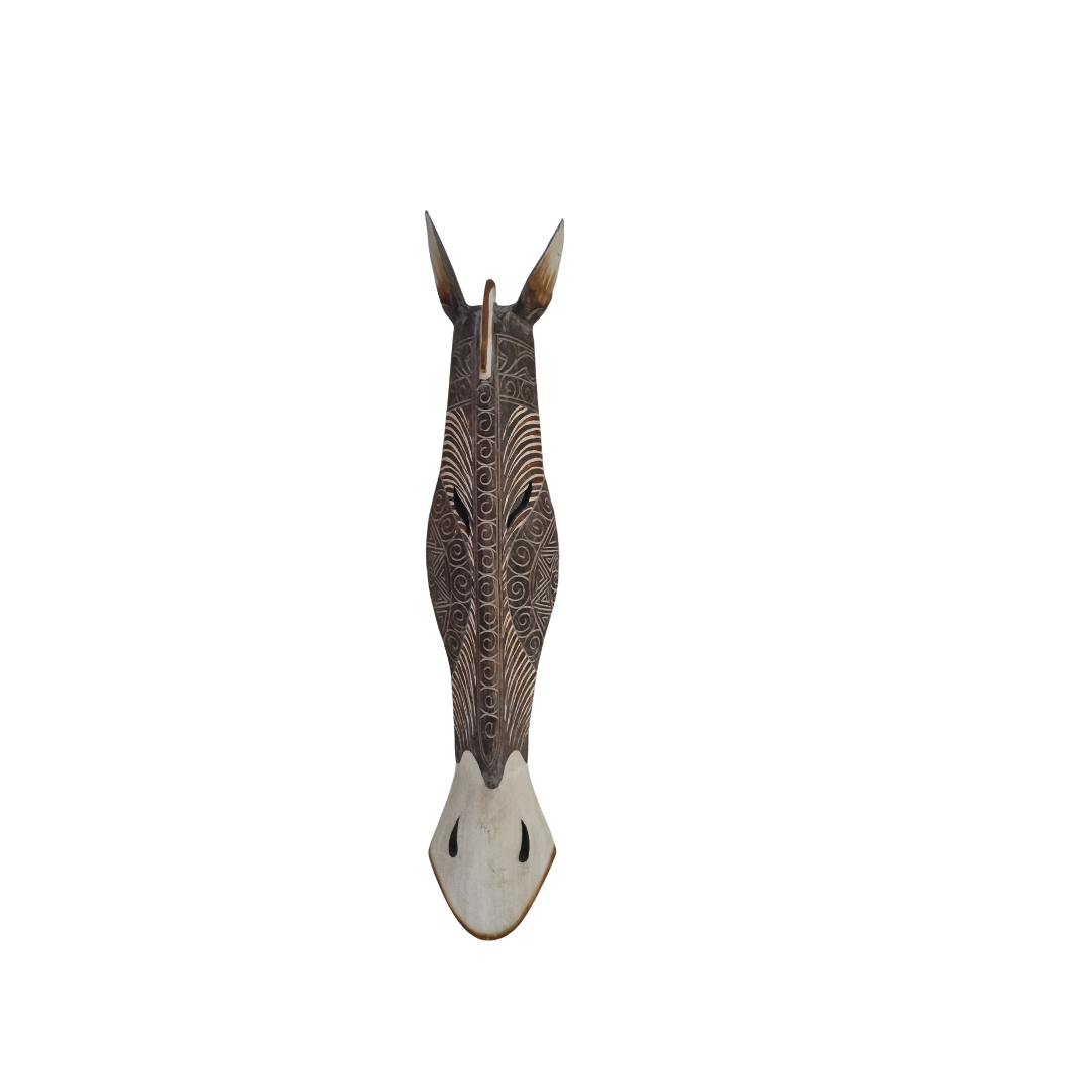 Decorative zebra head sculpture with intricate patterns on a white background