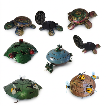 Collection of decorative turtle figurines with various designs on a white background