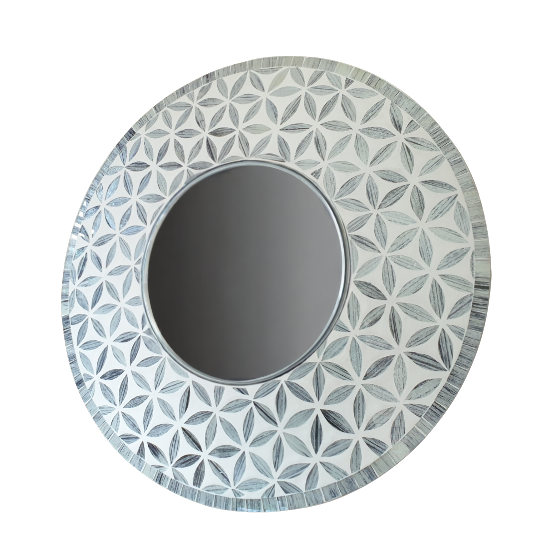 Round mirror with a decorative geometric pattern on a white background