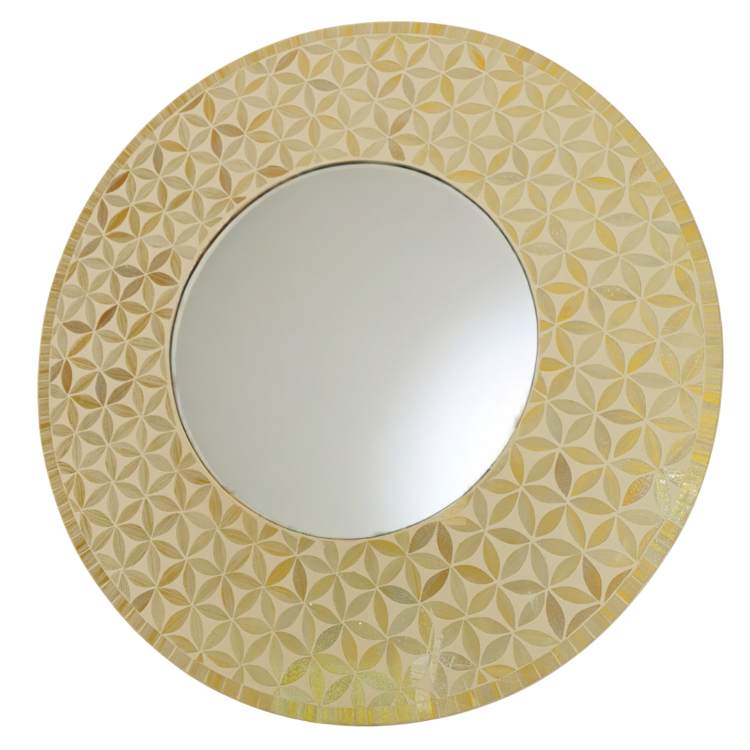 Round mirror with a decorative yellow and beige patterned frame on a white background
