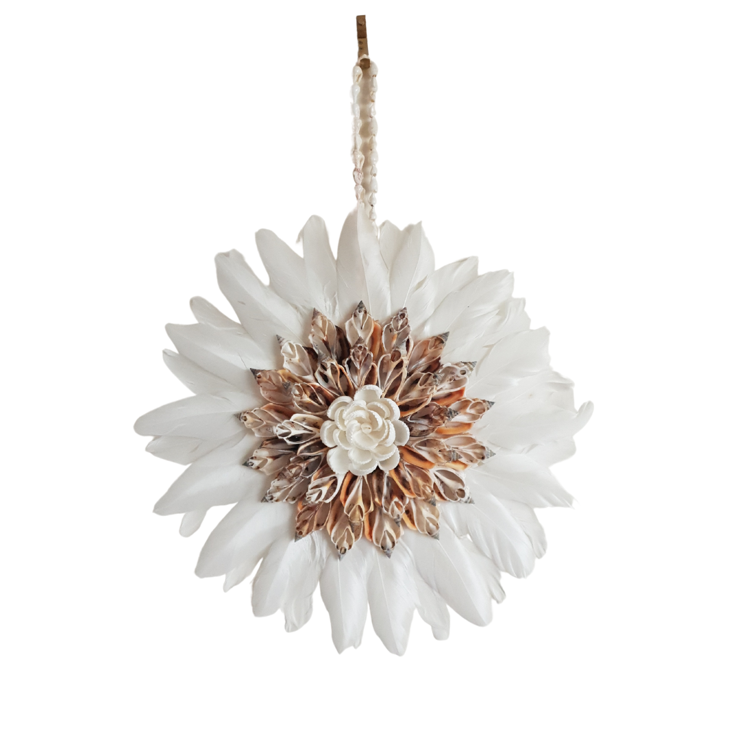 Handcrafted wall art made from shell arrangement and features 