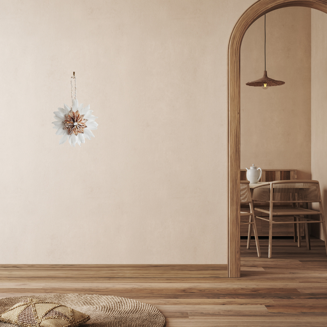 Juju Hat on a  wall with natural furniture 