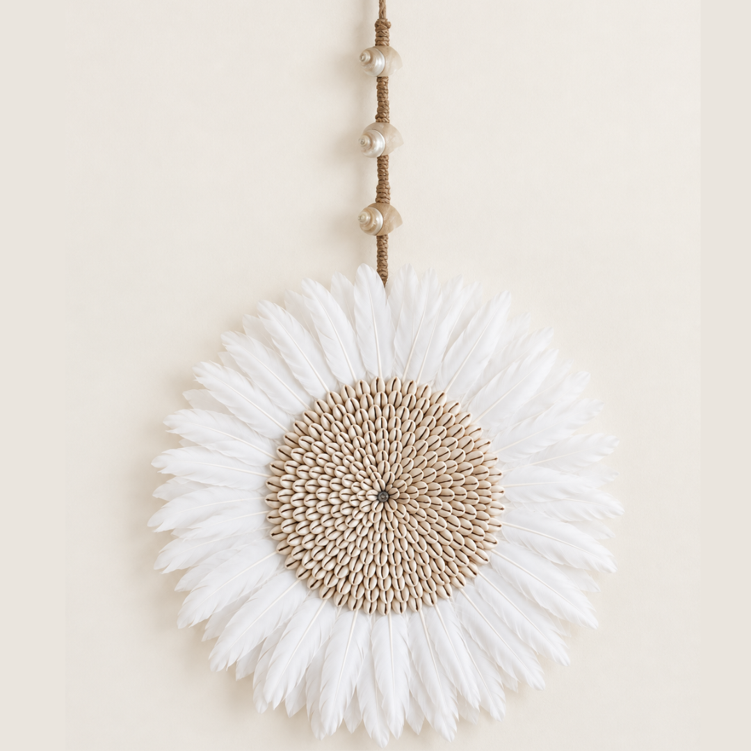 Large 65cm length white feather wall piece with a wide cowrie shell centre and long jute hanging cord.