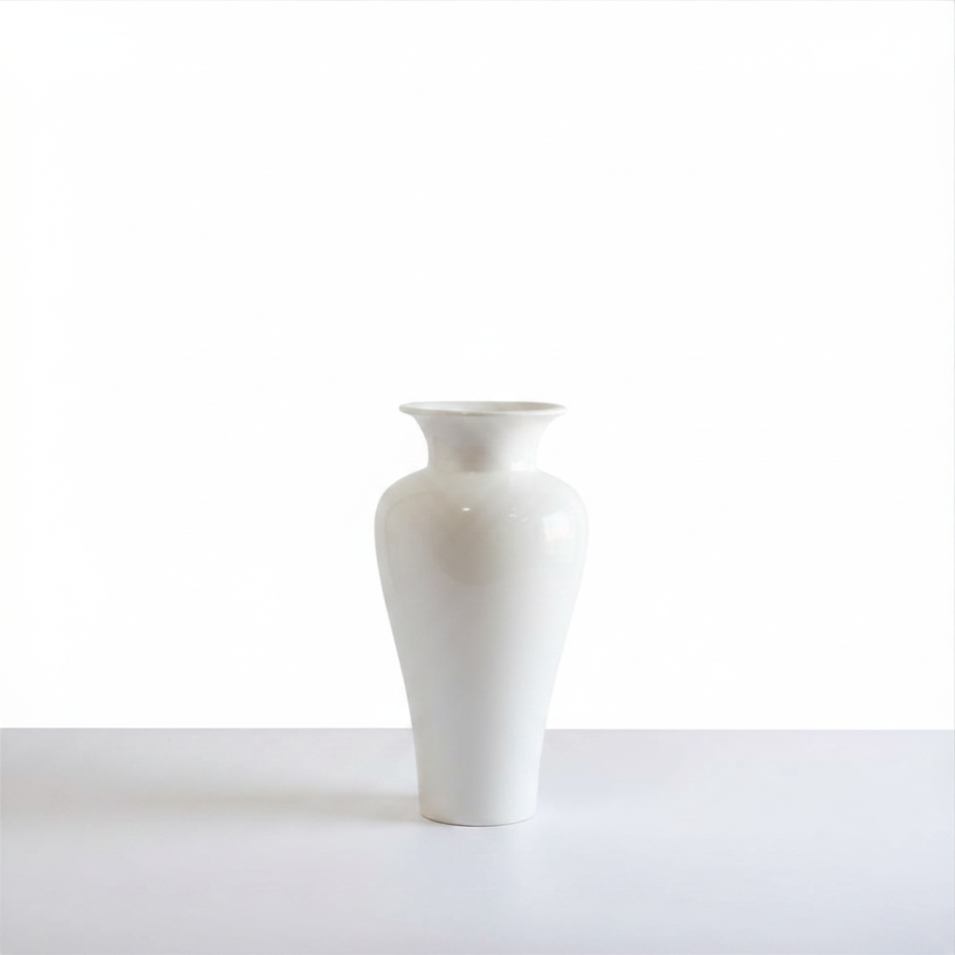 White gloss ceramic urn vase on a white surface with a clean bright background