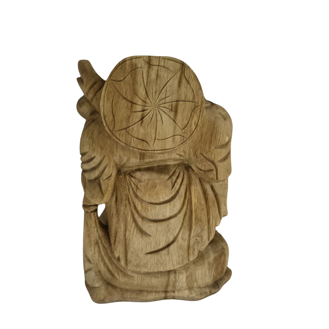 Rear view of a timber carving showing a decorative medallion on the back