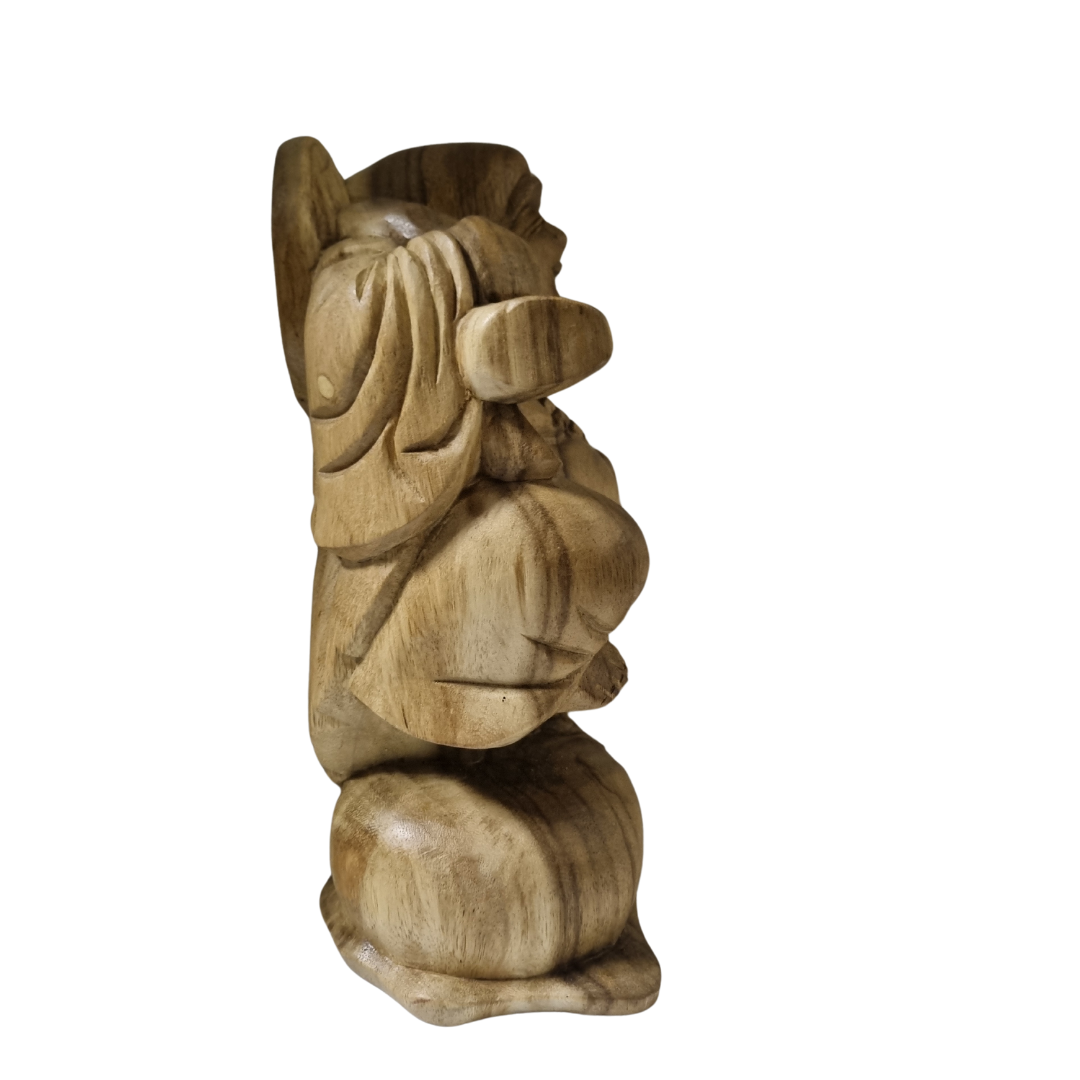 hand-carved timber figure, side profile showing praying hands, natural wood finish