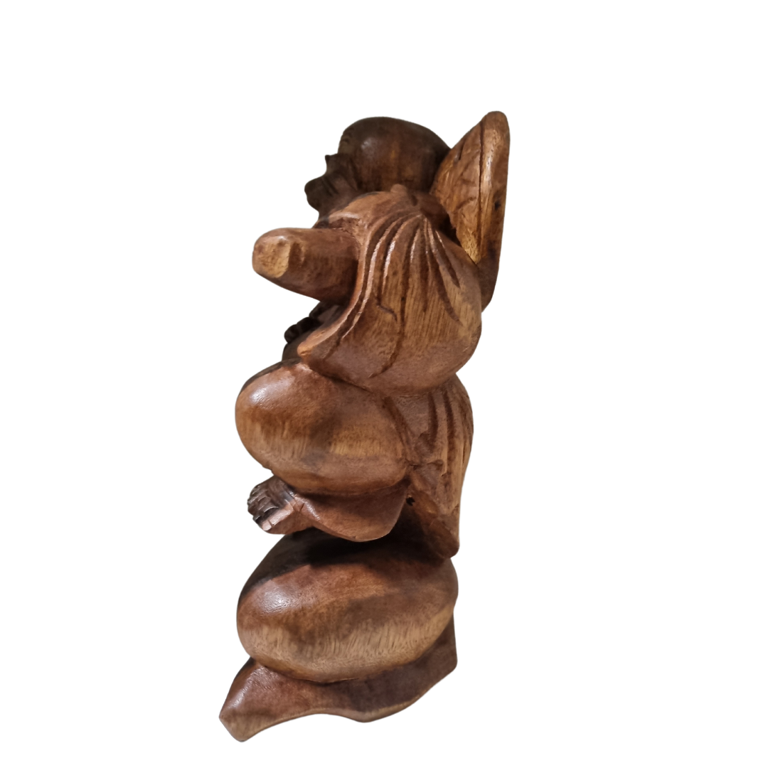 Dark timber carving, side profile showing draped robe detail