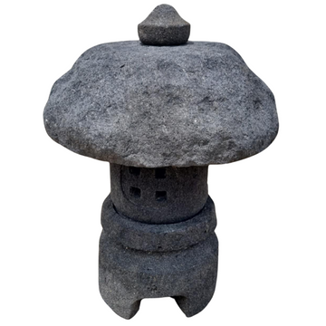 Lava stone garden lantern hand-carved by skilled artisans — naturally unique, built to last outdoors. Available in two sizes. Contact us for delivery or pickup