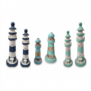 Six decorative lighthouse figurines in various sizes, featuring distressed finishes in navy blue, teal, and off-white, arranged on a plain white background.