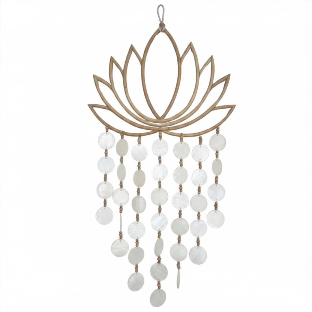 Decorative wall hanging with lotus flower design and white beads on a white background