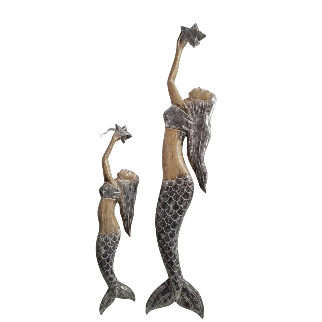 Handcrafted wooden mermaid wall art holding a starfish, displayed on a white wall, rustic coastal décor