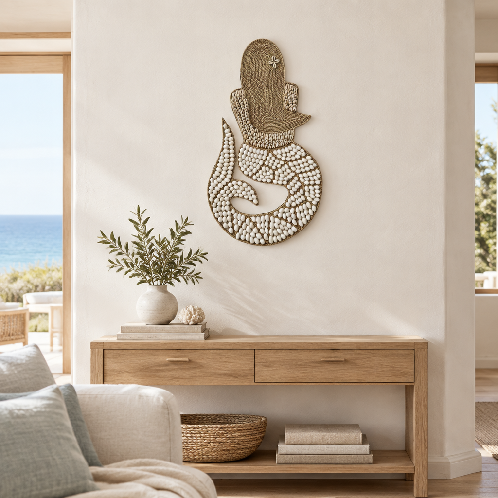 Curled white tail and woven jute detail displayed above a light timber console in a bright living room