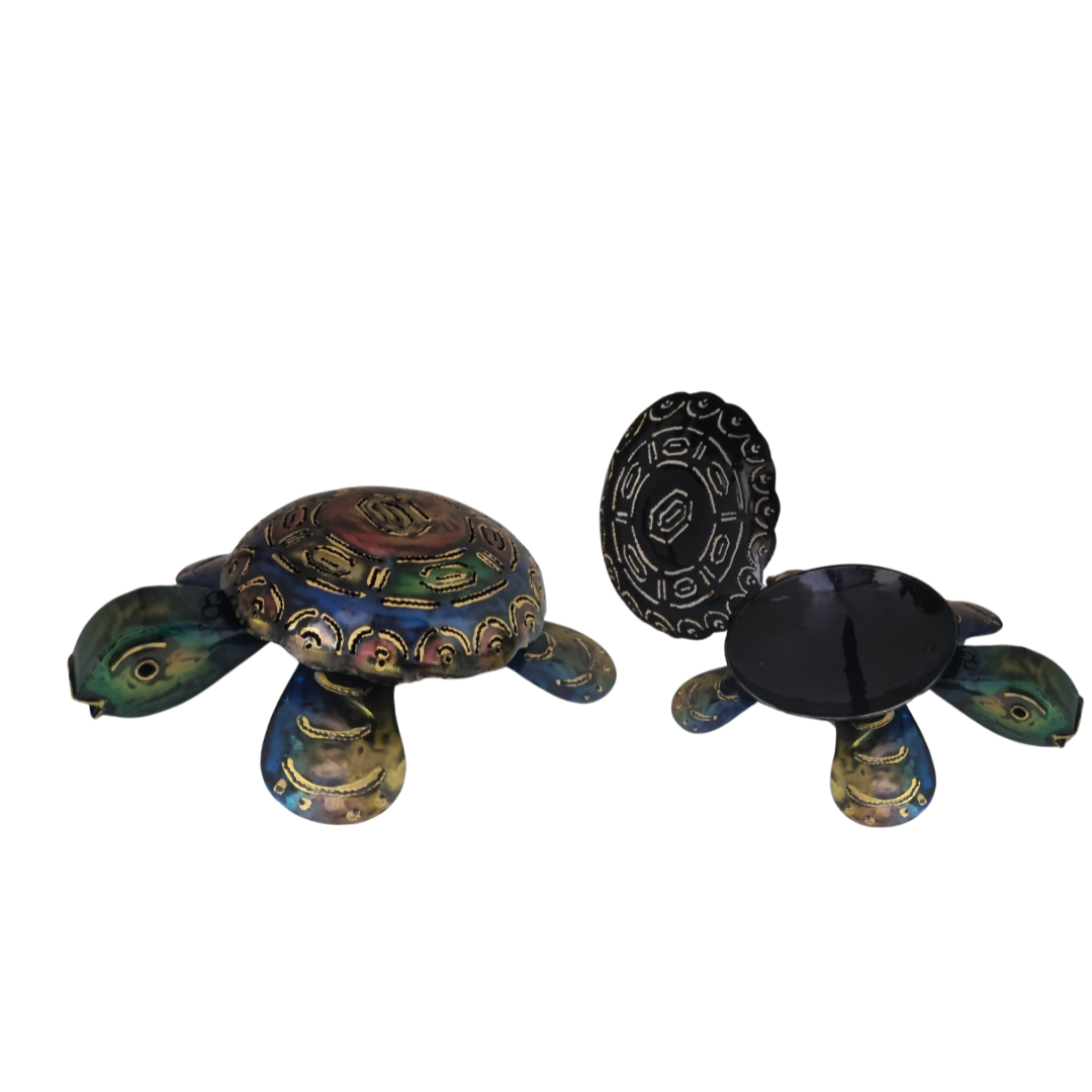 Two turtle-shaped objects with decorative patterns on a white background