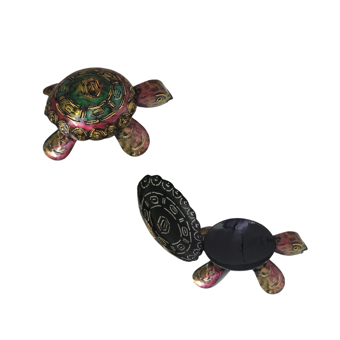 Two turtle-shaped objects with decorative patterns on a white background