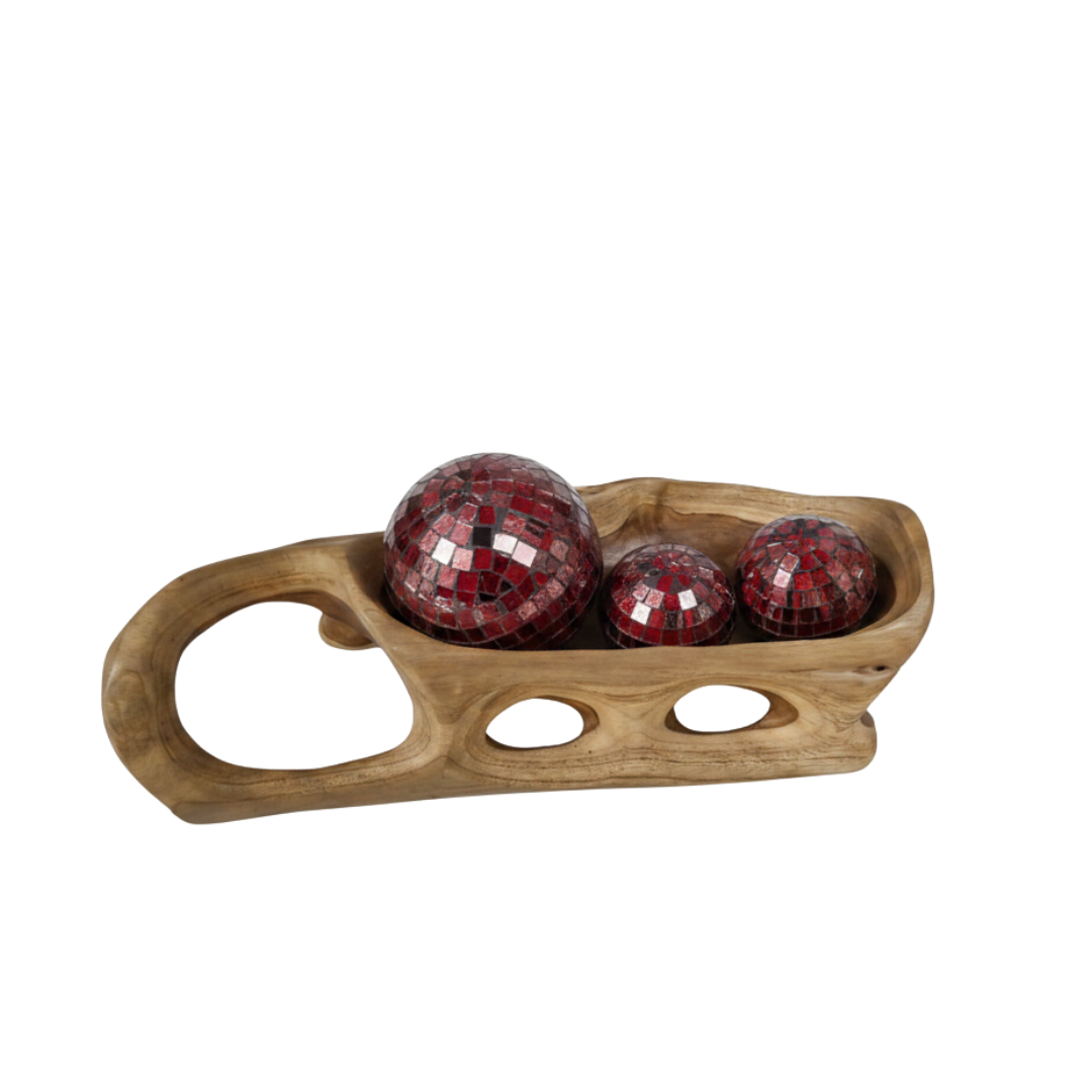 Red mosaic decorative balls resting inside a natural teak root tray on a white background.
