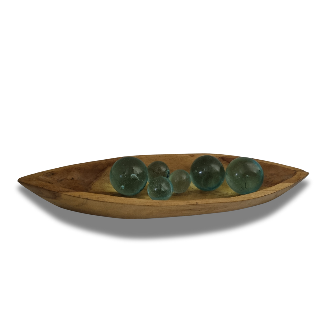 wooden shape service tray on a white back drop with additional decorative glass balls 