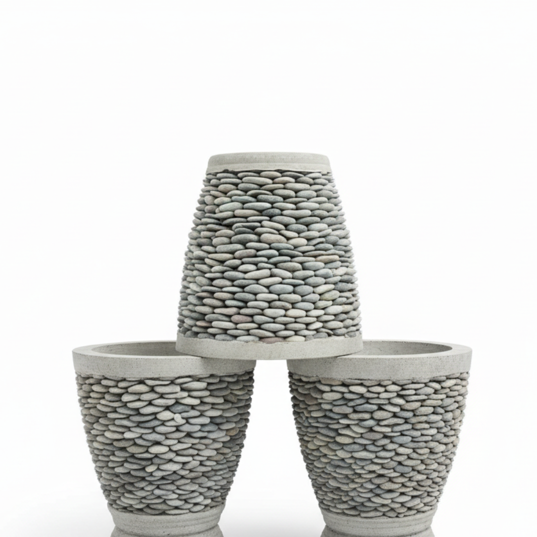 Three stone-textured tapered planters stacked in a pyramid, the smallest upside down on top, against a white background