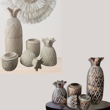 Collection of decorative pineapple canisters with textured patterns on a neutral background