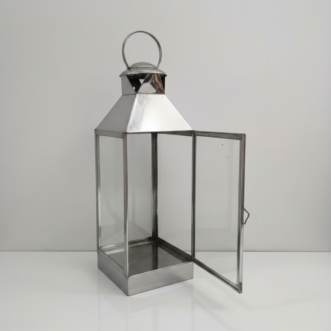 pyramid roof and round loop handle, glass door open showing interior photographed on a light grey background