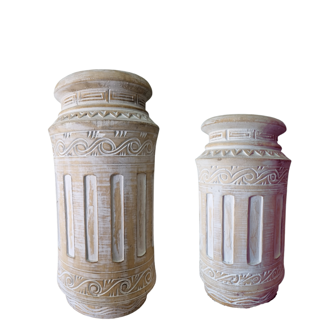 Pillar style table top decorative pieces set on a white background