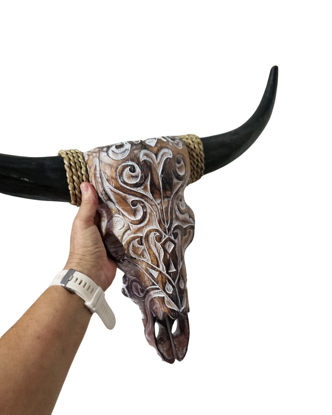 Close-up detail showing tribal patterns, rope-wrapped horn and brown wash finish