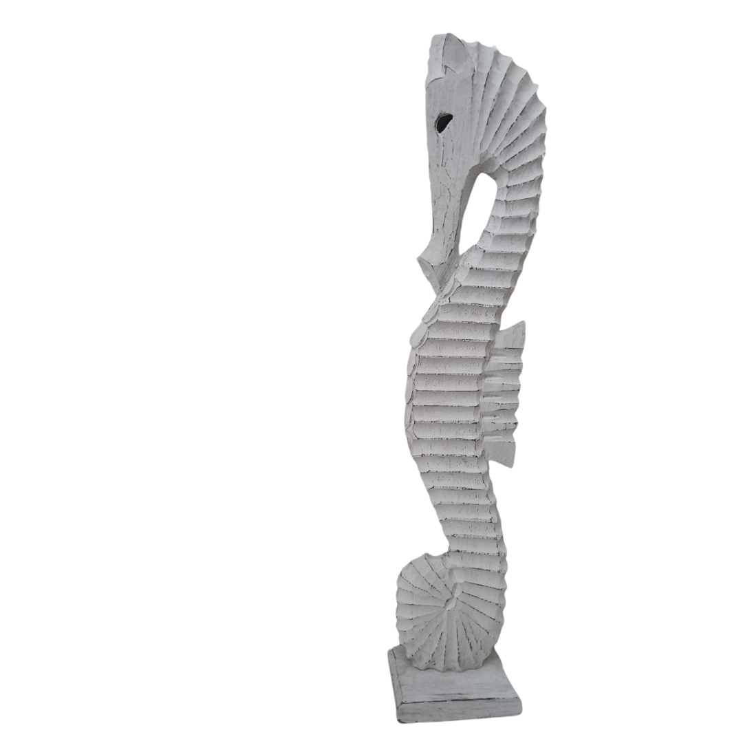 one large Seahorse Wooden Carved Statue on a white back wall 