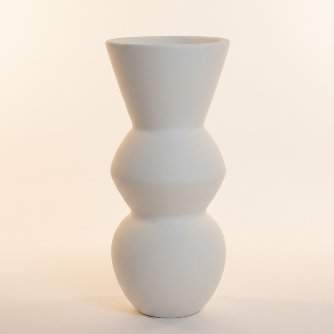 Sculptural decorative object with stacked bubble form and wide flared opening in matte white, white background