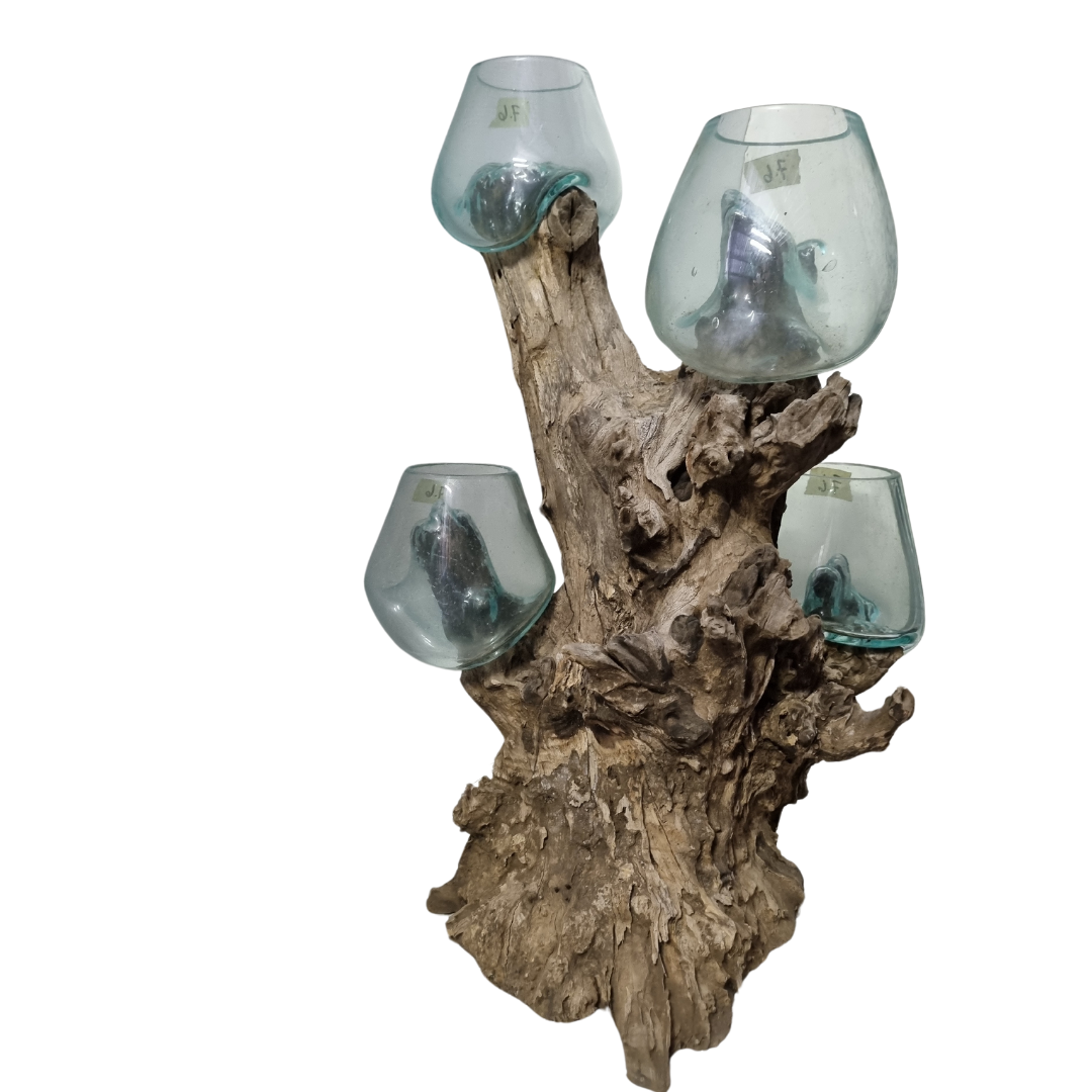 Tall natural wood trunk with four small hand-blown aqua-tinted glass bowls nestled on the upper branches, white background