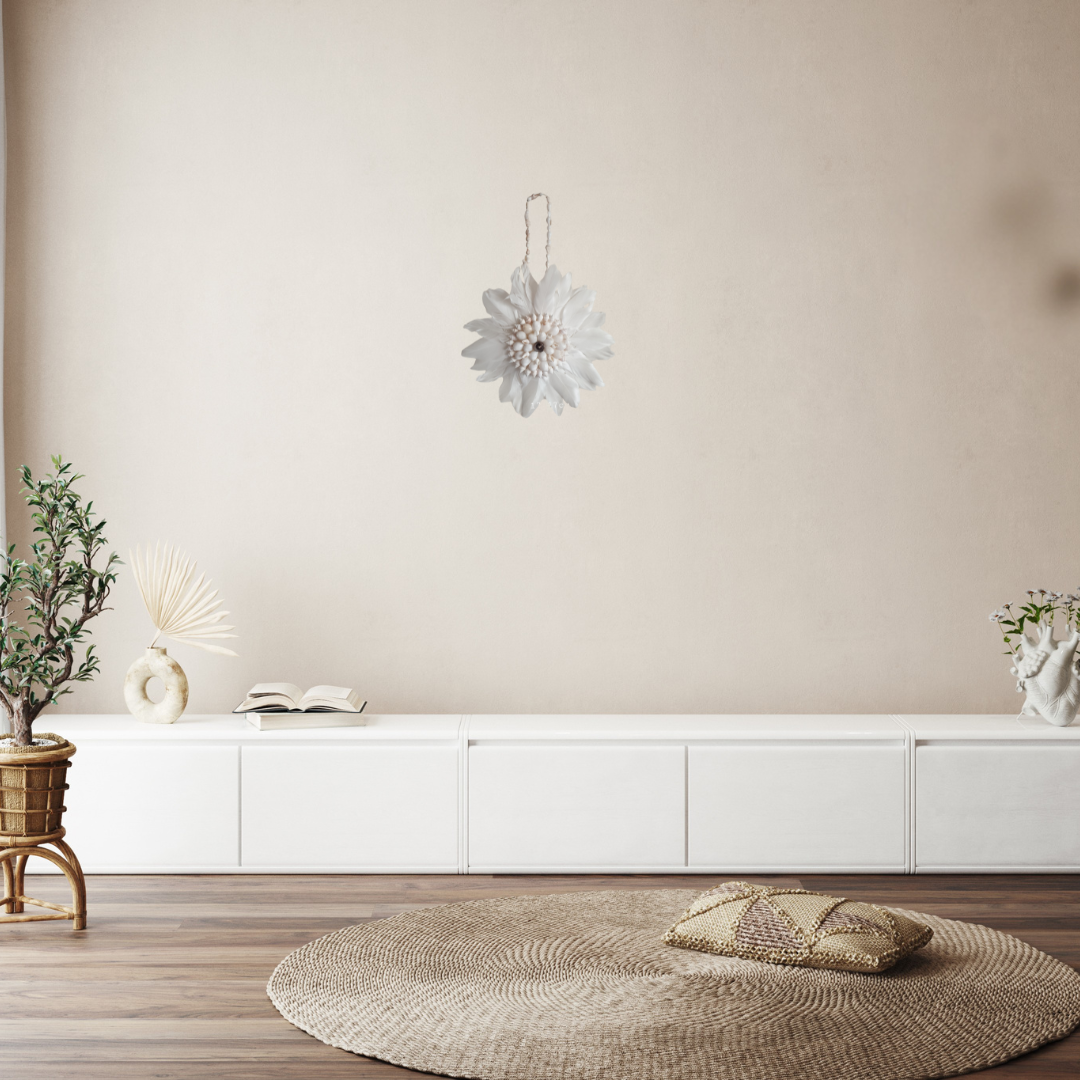Modern living room with white cabinets, a round woven rug, and decorative items.