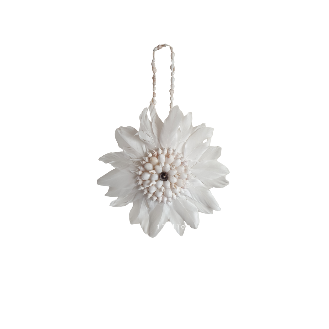 Decorative white flower ornament hanging on a white background