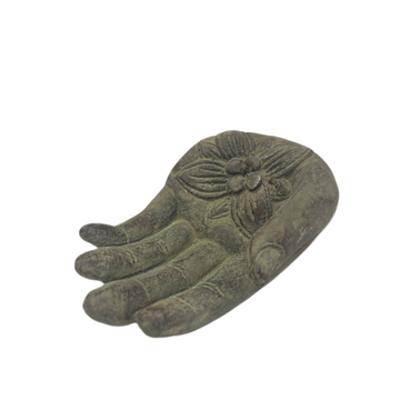 Stone Hamsa Hand Incense Holder with carved floral detail and a pink incense stick on a white background.