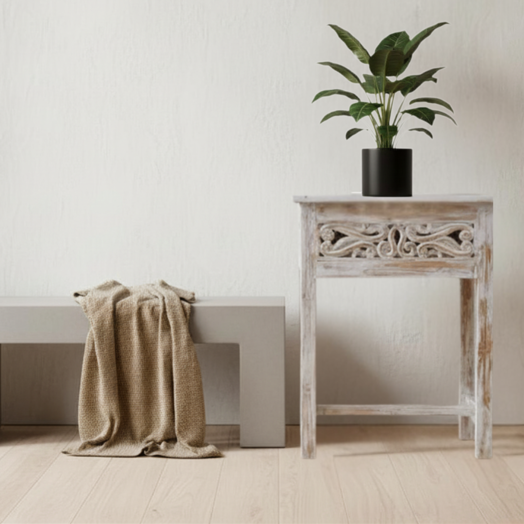 Minimalist interior with a bench, plant, and decorative white wash timber table 