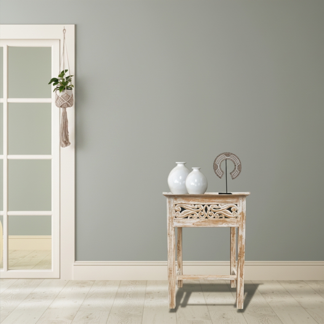 Stylish side table reclaimed teakwood in coastal hallway setting with white ceramic vases and macrame plant hanger