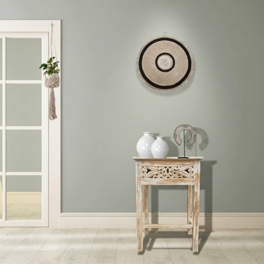 Stylish side table reclaimed teakwood styled in bohemian hallway with white ceramic vases and woven wall art