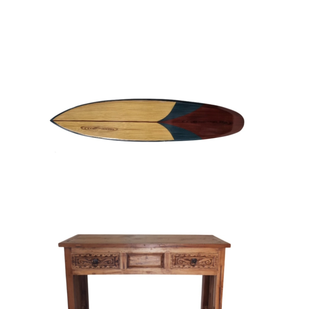 Wooden surfboard-shaped table on a white background