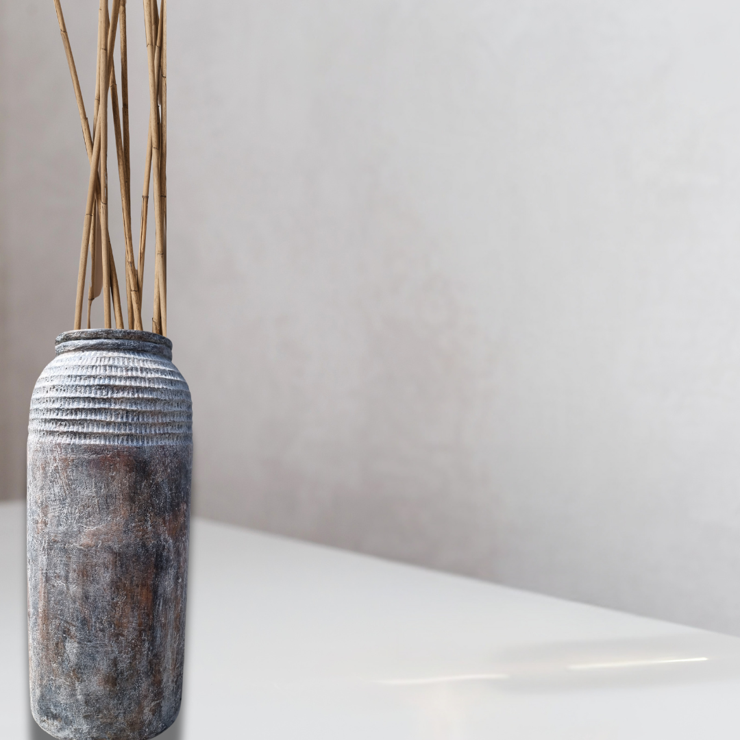 A tall cylindrical rustic pot suitable for indoor or outdoor use, finished in brown and gray tones with a ribbed texture.