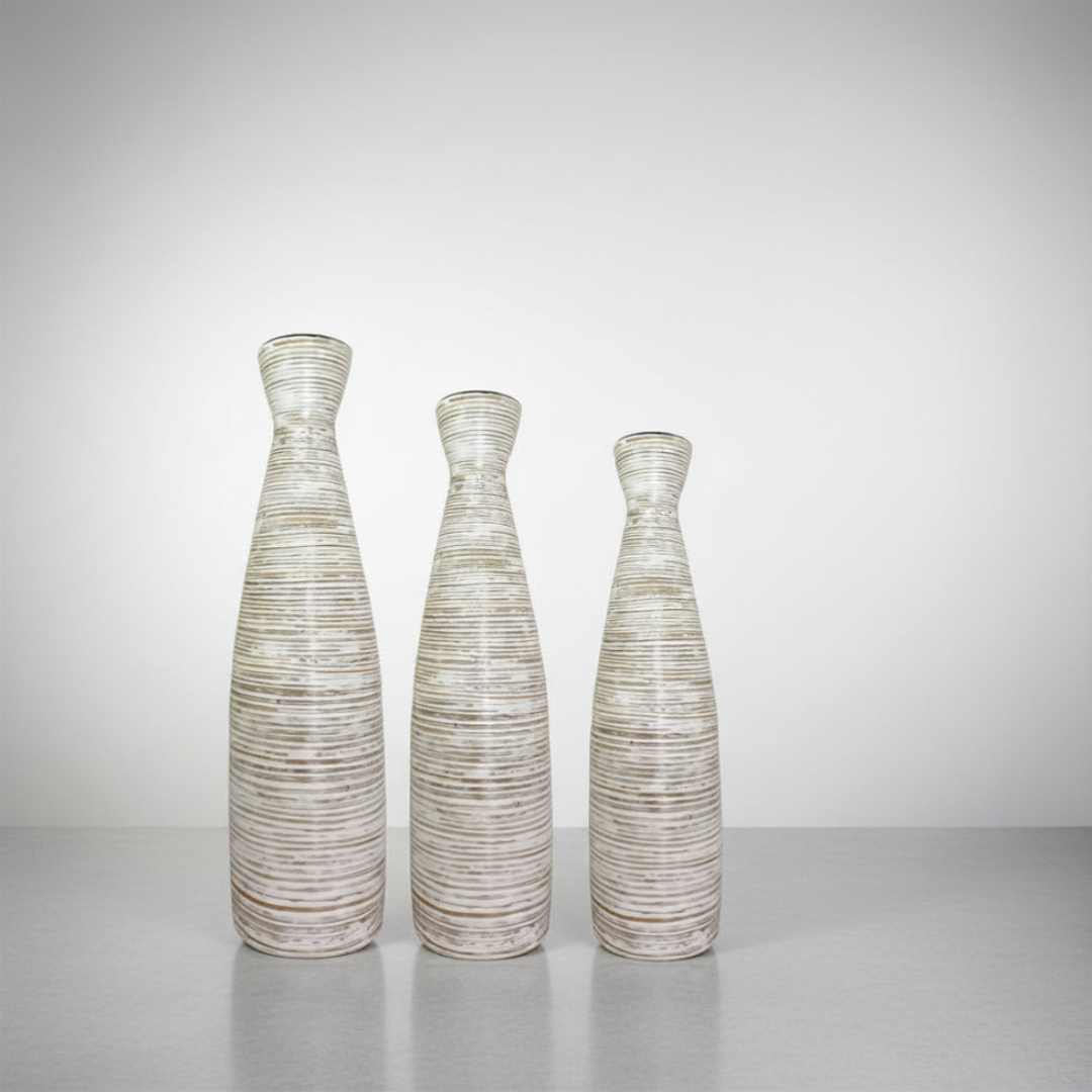 Tall Slender Cylinder Style Vase set of three in small, medium and large, ribbed whitewash finish on a white surface