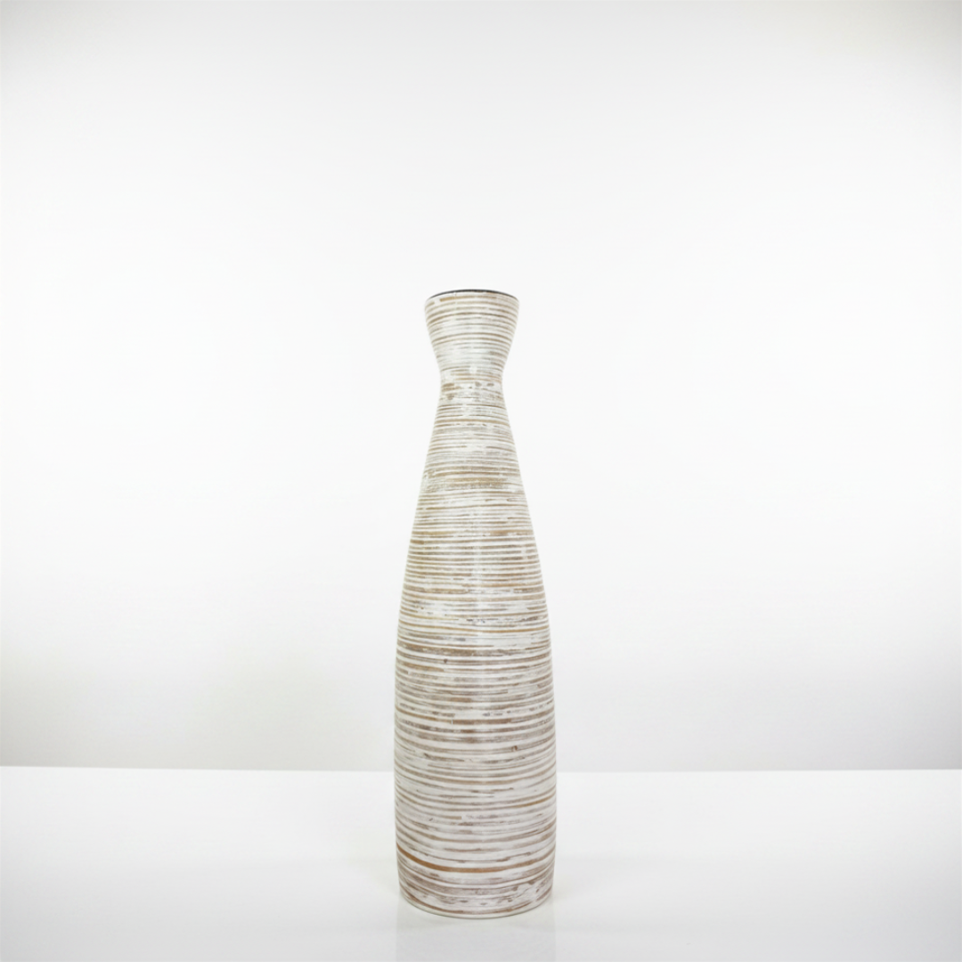 Decorative vase with ribbed texture on a white background