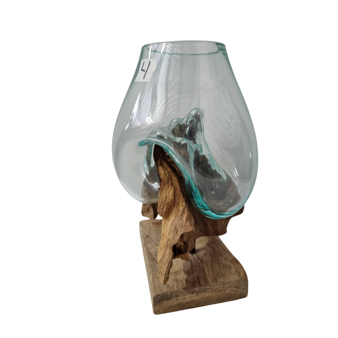 Natural driftwood root base with handblown glass vessel, close-up detail view