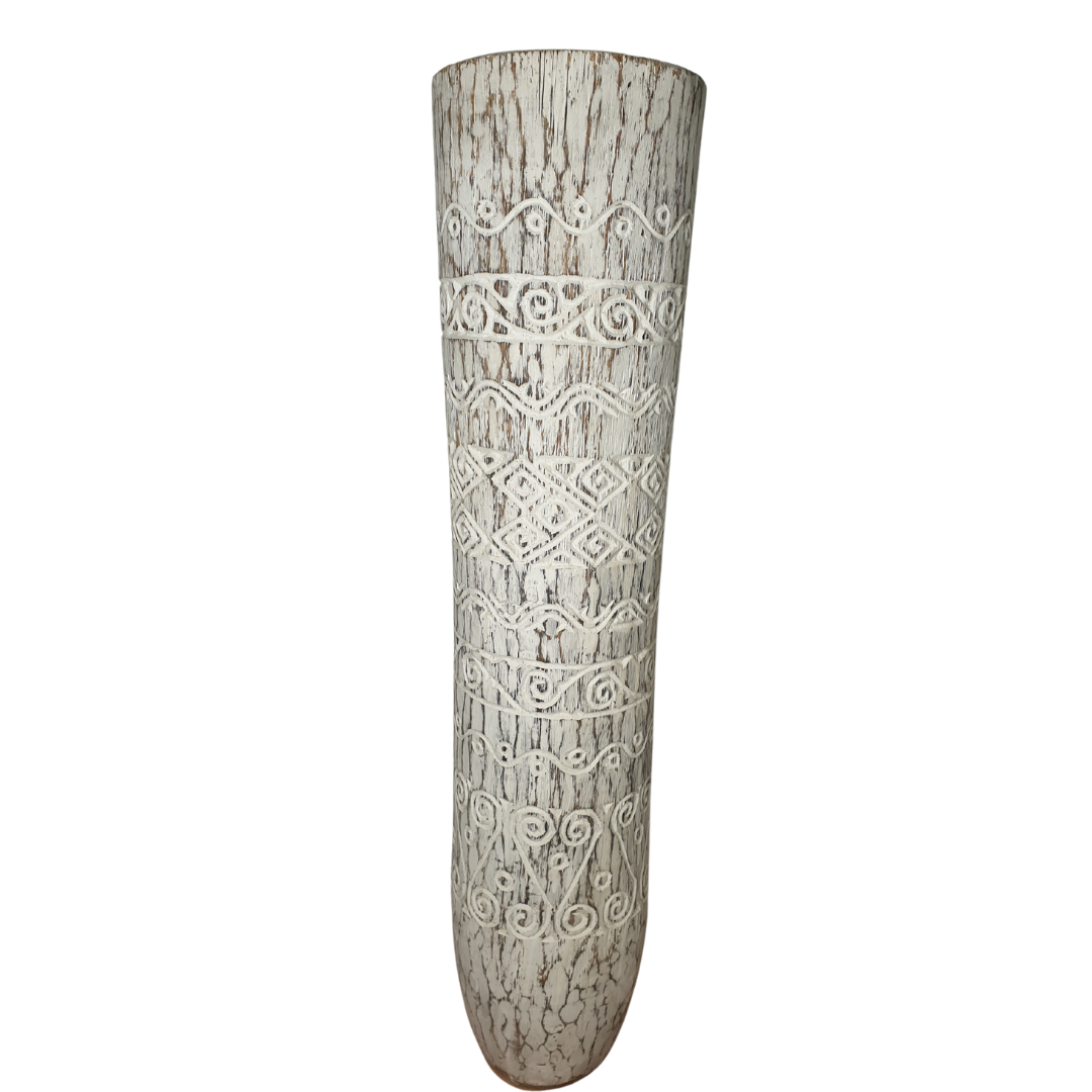 natural coco tree wood crafted in a whitewash finish with tribal style art work carvings on the outside. 