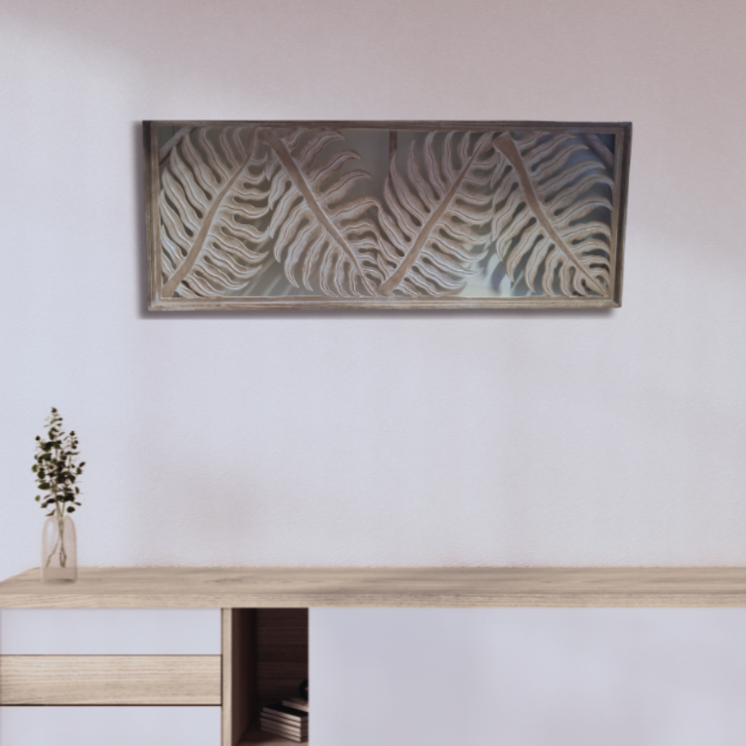 Tropical fern leaf wall hanging in natural wash finish displayed horizontally above a timber desk with dried floral arrangement