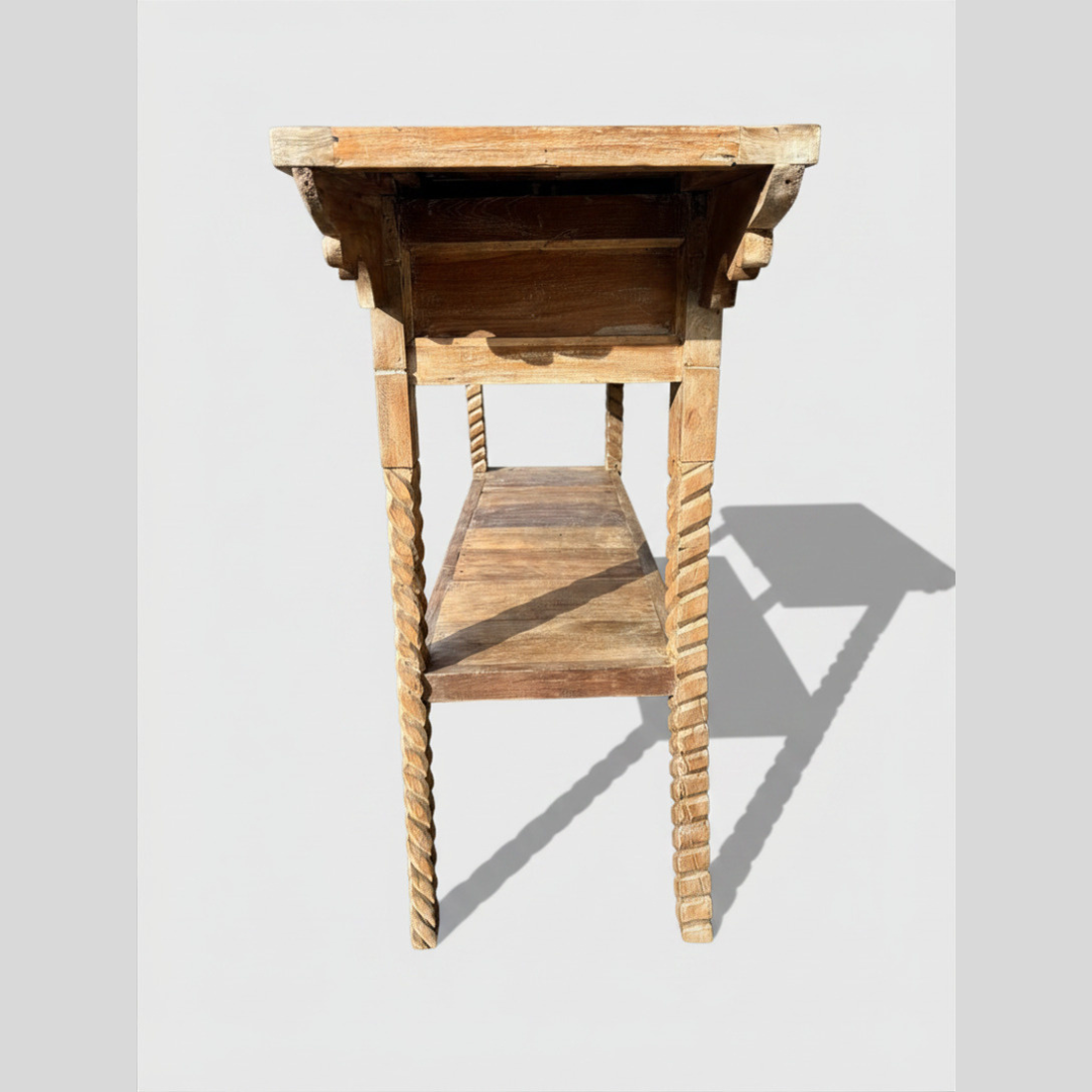 Wooden side table with a rope-like design on a light gray background