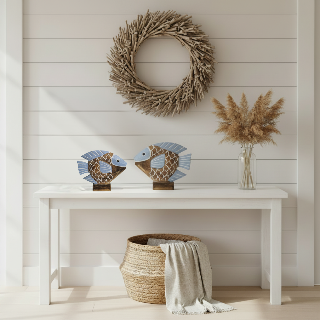 Tropical Fish Decor light blue set on a whitewashed hallway console table with driftwood wreath and pampas grass