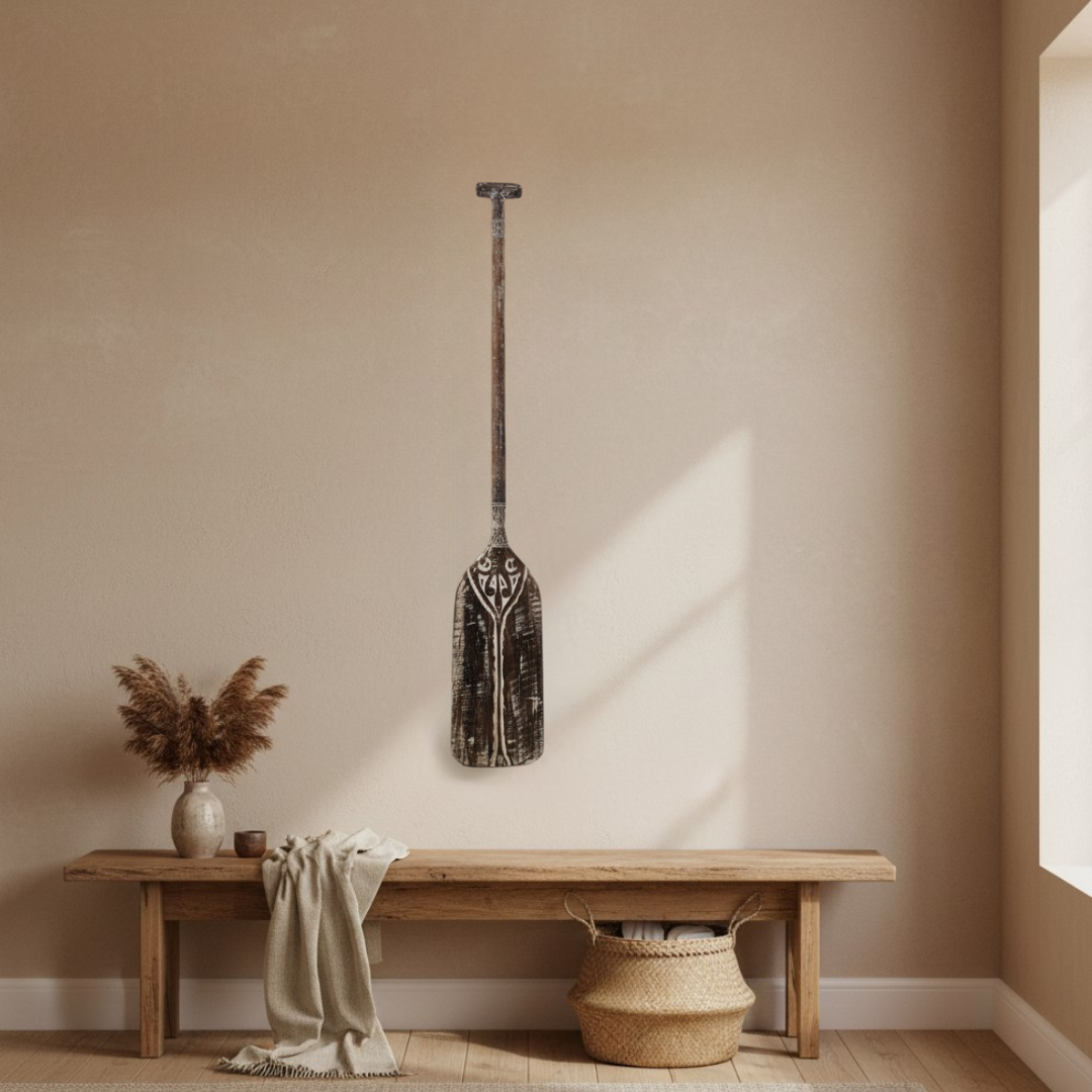 styled the exact 130cm paddle as one statement piece above a timber console, keeping its dark distressed finish, carved details, shape, and proportions intact.
